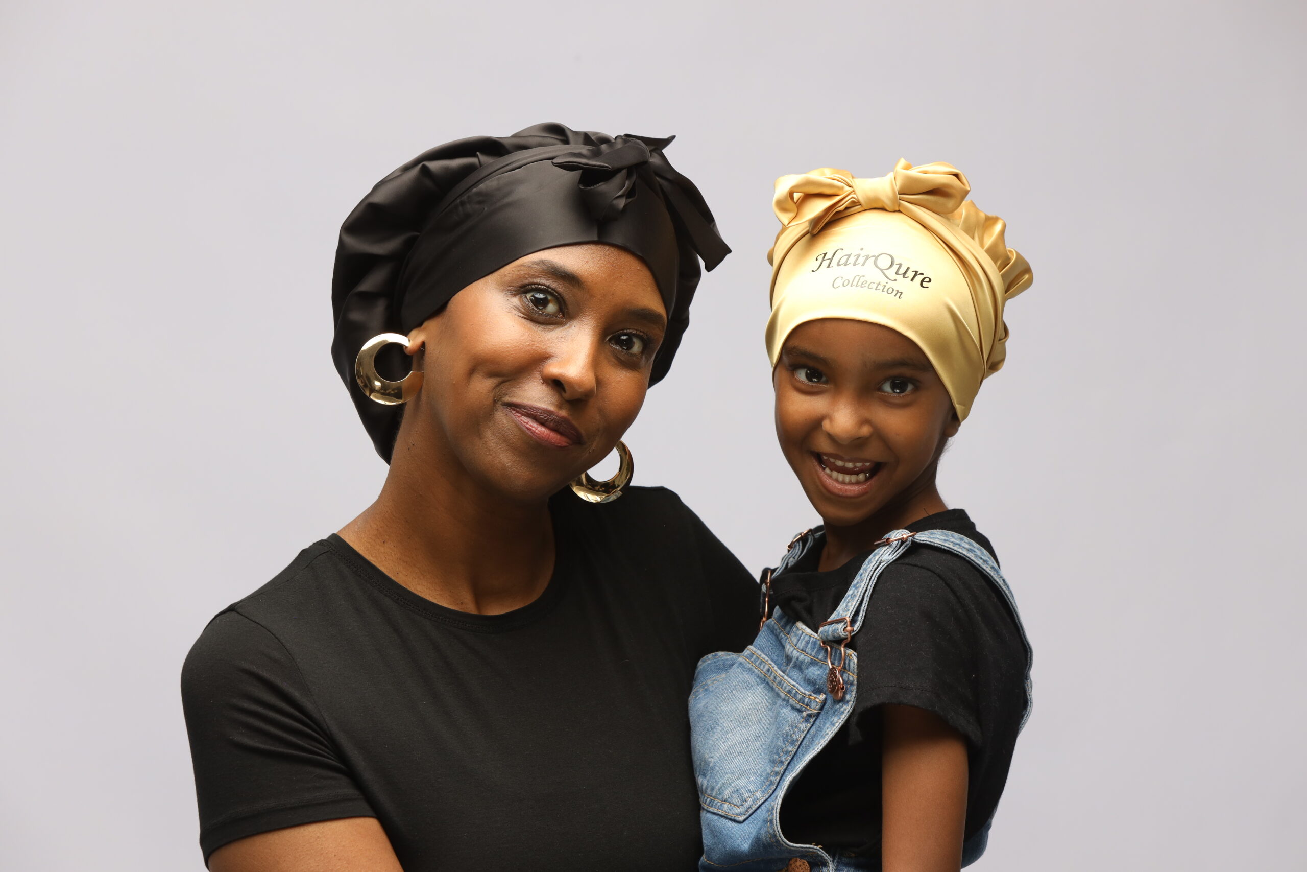 Miss K and her daughter wearing HairQure silk bonnets